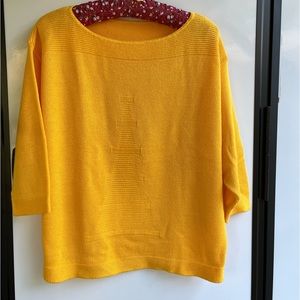 Sweater in bold yellow with 3/4 sleeves and large size.  Brand unknown.